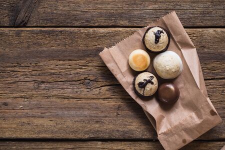 Chocolate pralines on old wooden table. Foodの写真素材