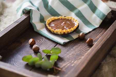 Candies on a brown tray.の写真素材