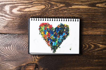 Acrylic hearts on notebookの写真素材