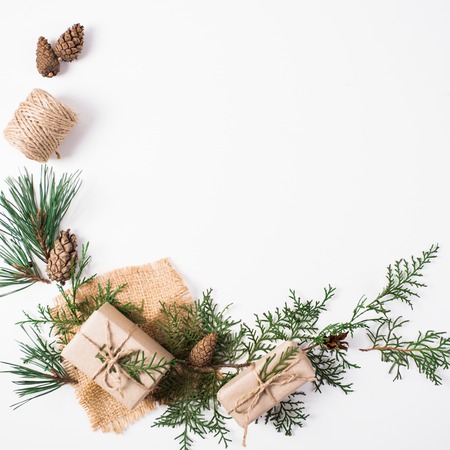 Christmas composition. Gift, christmas decoration, cypress branches, pine cones on white backgroundの写真素材