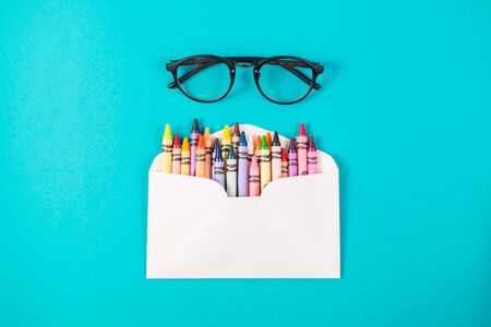 pencilics in the envelope on wooden background top viewの写真素材