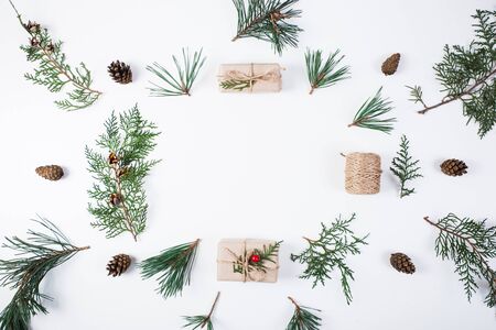 Christmas composition. Gift, christmas decoration, cypress branches, pine cones on white backgroundの写真素材