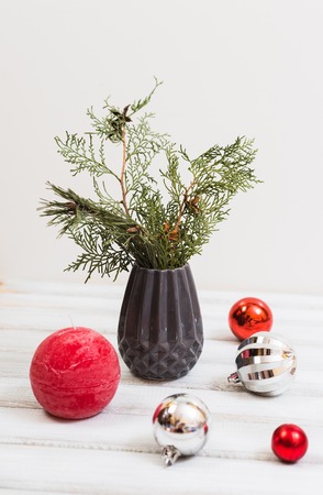 Christmas composition with spruce branches, candles, a vaseの写真素材