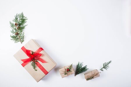 Christmas composition. Gift, christmas decoration, cypress branches, pine cones on white backgroundの写真素材