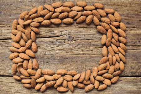 Almonds on wooden backgroundの写真素材