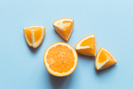 Fresh oranges on the blue background