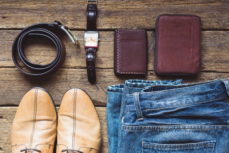 Men's clothes and accessories on wooden background. Top viewの写真素材