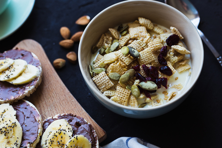 Healthy breakfast. Fresh granola, muesli with milk berries nuts. View from above.