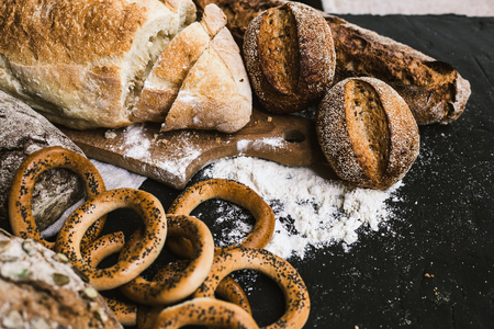 Many mixed breads and handmade bagelsの写真素材