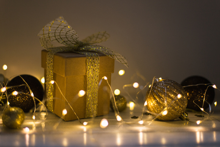 Christmas decoration with fir tree, gift box, garland lights, toys. Winter holidays, Merry Christmasの写真素材