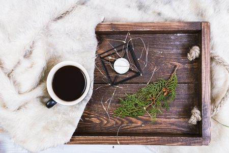 Christmas decor. Christmas toy, cup of coffee and candleの写真素材