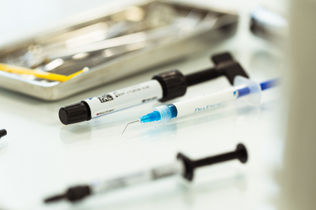Different dental tools and syringe with anesthesiaの写真素材
