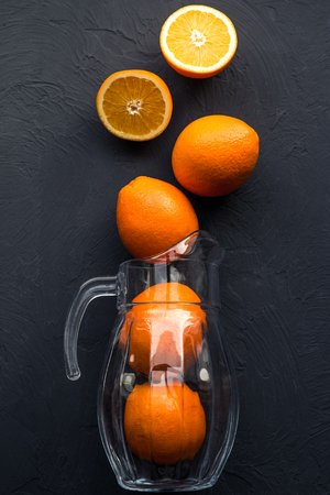 Fresh juicy oranges on wooden tableの写真素材