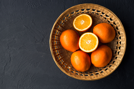 Fresh juicy oranges on wooden tableの写真素材