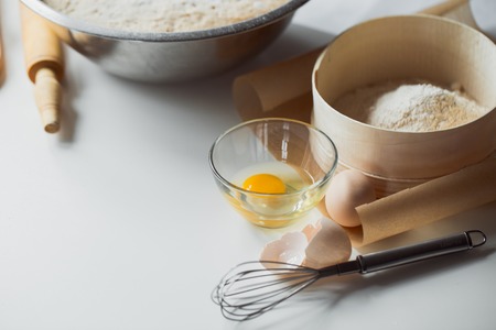 Bread dough rising in a bowl after proofingの写真素材