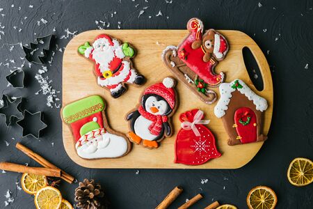 Christmas square card with gingerbread cookies, snowflakes, gingerbread men, snowman, reindeer and...