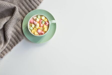 Cup of hot cocoa with marchmallows on white backgroundの写真素材
