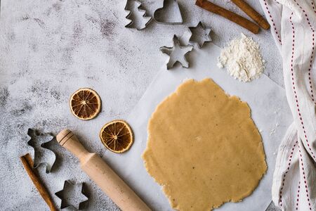 Cooking Christmas gingerbread cookies on a gray background.の写真素材