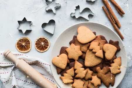 Christmas gingerbread with cinnamon on a gray table.の写真素材