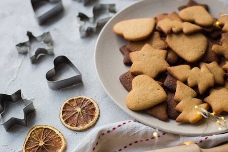 Christmas gingerbread with cinnamon on a gray table.の写真素材