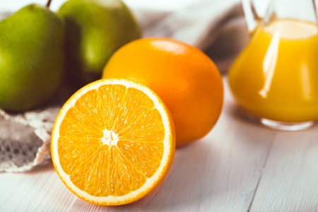 Fruit oranges and pears on a white wooden background. View from above. Close-upの写真素材