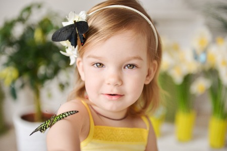 little girl with a butterflyの写真素材