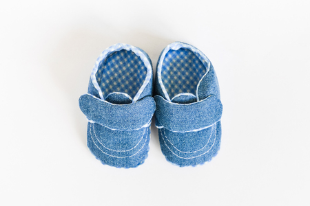 Baby shoes for newborns on isolated backgroundの写真素材