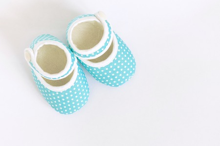 Baby shoes for newborns on isolated backgroundの写真素材