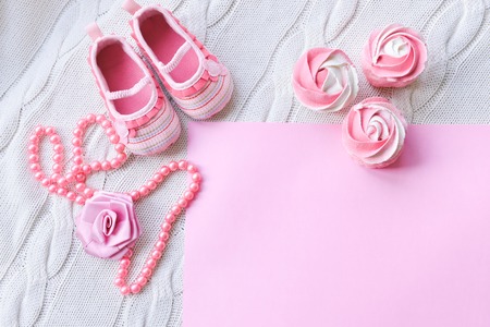baby shoes on a white backgroundの写真素材