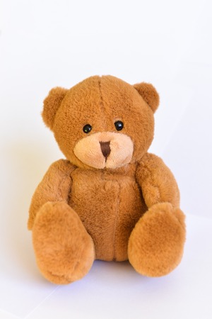 Brown Toy teddy bear, with black eyes. Isolated over white backgroundの写真素材