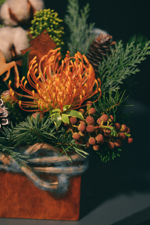 Christmas floral composition. a New Years bouquet with candles and a deerの写真素材