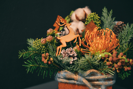 Christmas floral composition. a New Years bouquet with a deerの写真素材