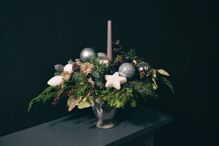 Christmas floral composition. a New Years bouquet with candlesの写真素材