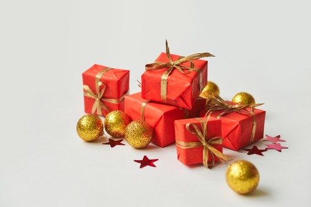 christmas composition, spruce branches to gifts in red boxes, christmas decor