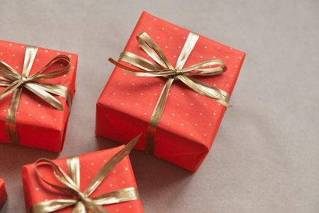 christmas composition, spruce branches to gifts in red boxes, christmas decor
