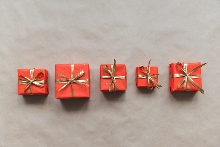 christmas composition, spruce branches to gifts in red boxes, christmas decor