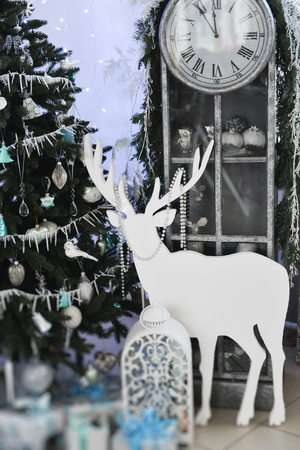 Christmas decor for table setting, or wedding decor, studio with a Christmas tree. Christmas decorations toys, candles, fir branchesの写真素材