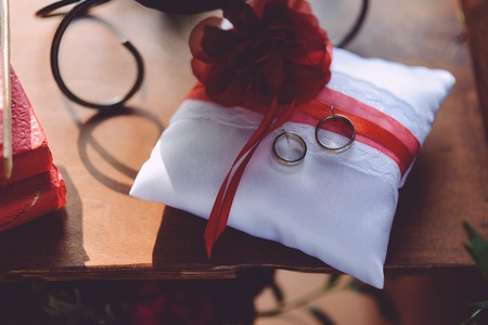 Newly wed couples hands with wedding ringsの写真素材