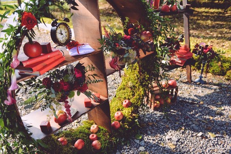 set of autumn wedding decor outdoors. Floral arrangement of flowers and fruits. details of the wedding ceremony. staging for the newlyweds decoratorの写真素材
