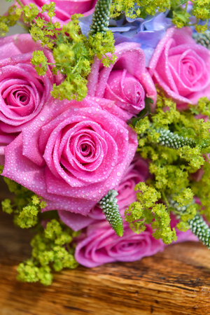 bridal bouquet of fresh roses on the table. wedding floristry, floristic decorative statementの写真素材