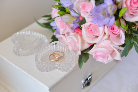 bridal bouquet of fresh roses on the table. wedding floristry, floristic decorative statementの写真素材