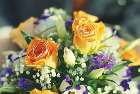 bridal bouquet of fresh roses on the table. wedding floristry, floristic decorative statementの写真素材