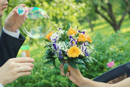 bridal bouquet of fresh roses on the table. wedding floristry, floristic decorative statementの写真素材