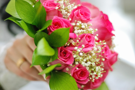 bridal bouquet of fresh roses on the table. wedding floristry, floristic decorative statementの写真素材