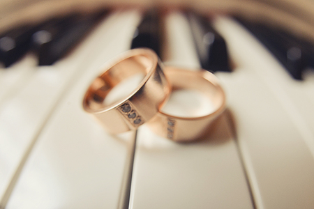 wedding rings lie on the piano keys, composition wedding decorの写真素材