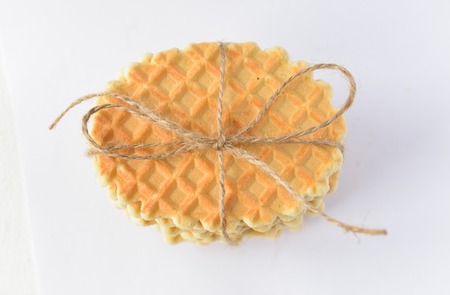 A stack round waffles isolated over white background.の写真素材