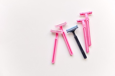 set shaving razors. female and male, blue and pink color on a white isolated backgroundの写真素材