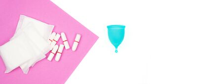 female personal hygiene products isolated on white background blue menstrual cup and swabs pads on a...