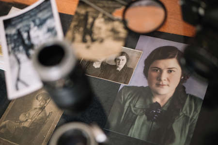 Belarus, Soligorsk, July 1, 2019: mastery of restoring old vintage damaged photos of close-up...