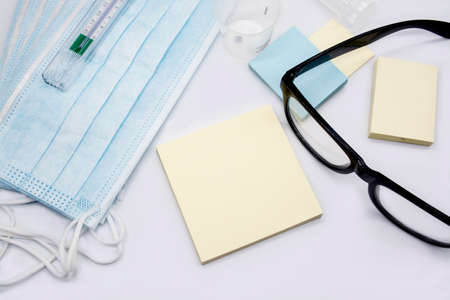 Doctor workspace with Medical equipment on white office desk, top view copy space.